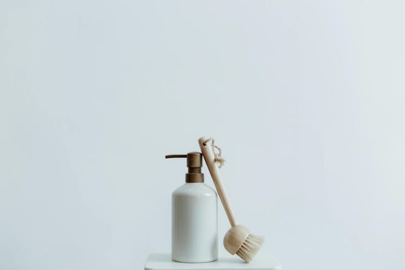 eco-friendly cleaning products with green leaf labels on counter