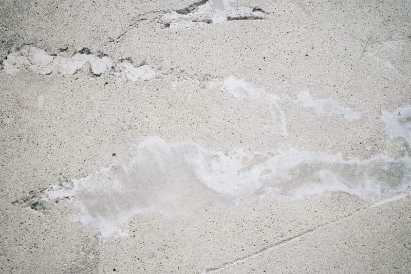 concrete slab with crack being repaired with epoxy injection