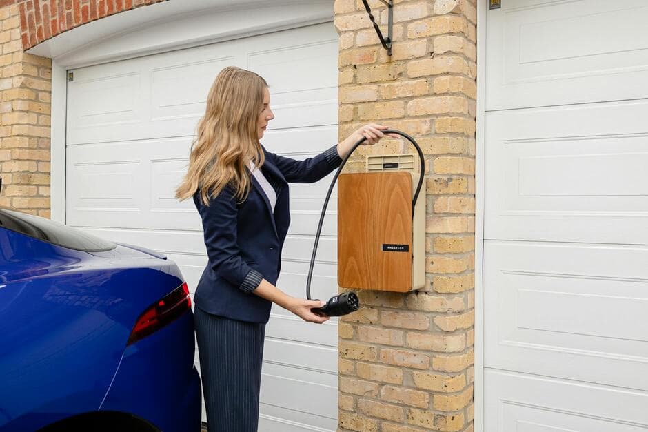 electrician installing a Level 2 EV charger in a garage