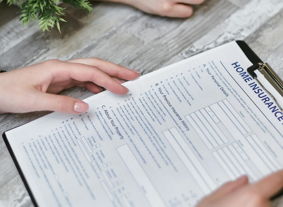 homeowner reviewing electrical insurance documents