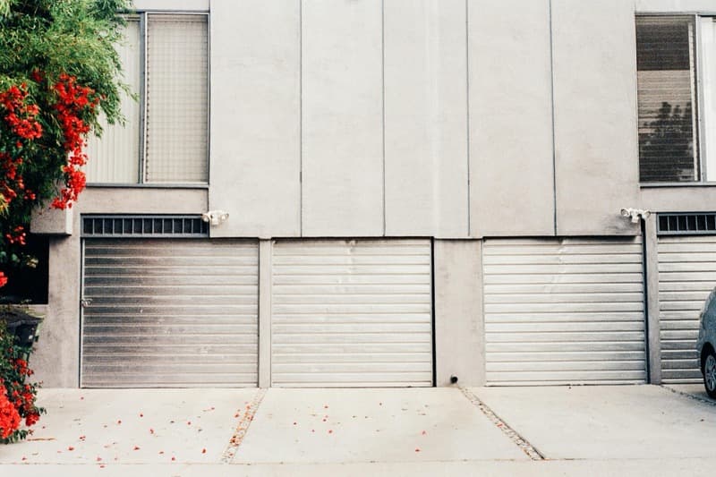 comparison of steel, wood, and carriage-house garage door styles