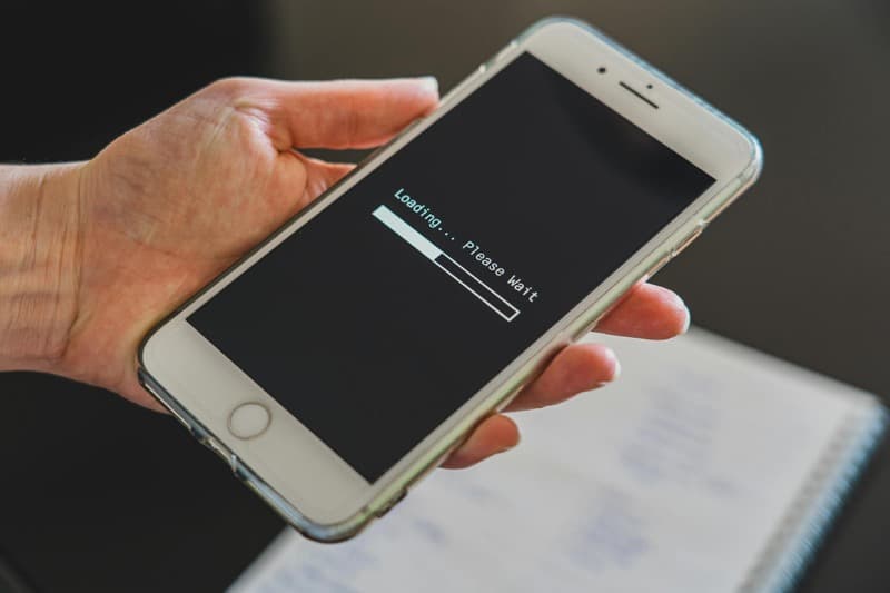 smartphone controlling smart garage door opener via mobile app