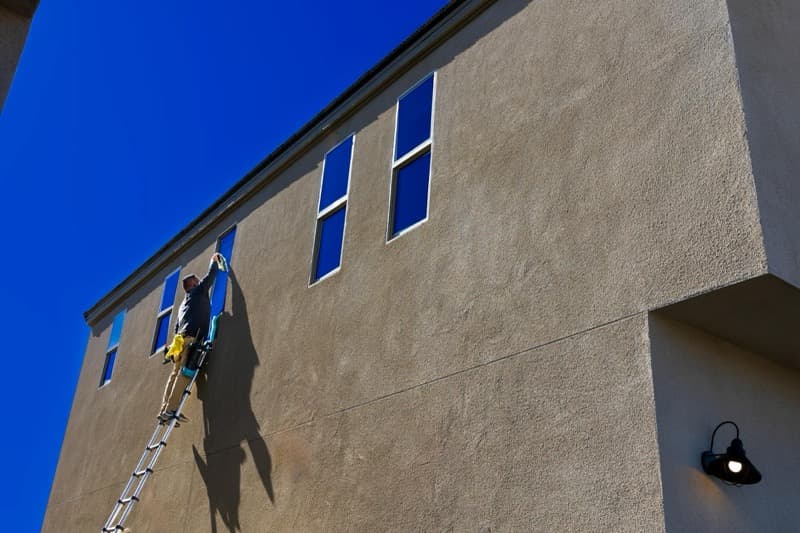professional gutter cleaning with vacuum system from ground level