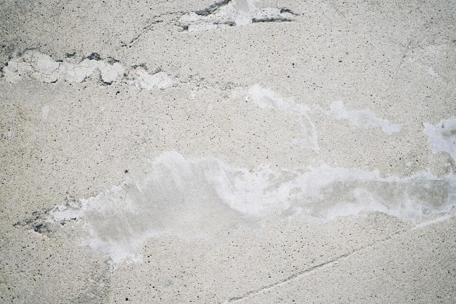 concrete slab with visible water damage from pipe leak